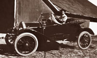 Clifton Kirk driving motor car - W-211-03